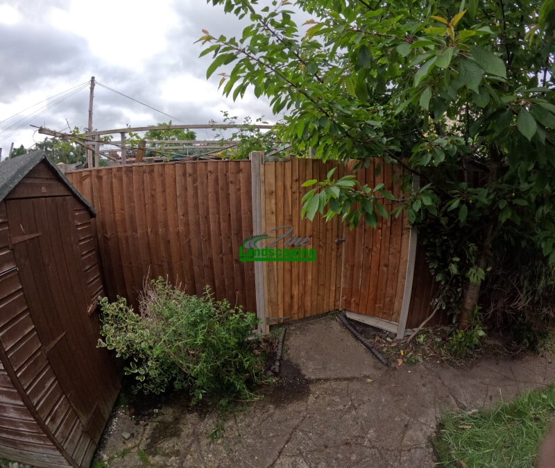 Timber fencing with a matching gate and planting