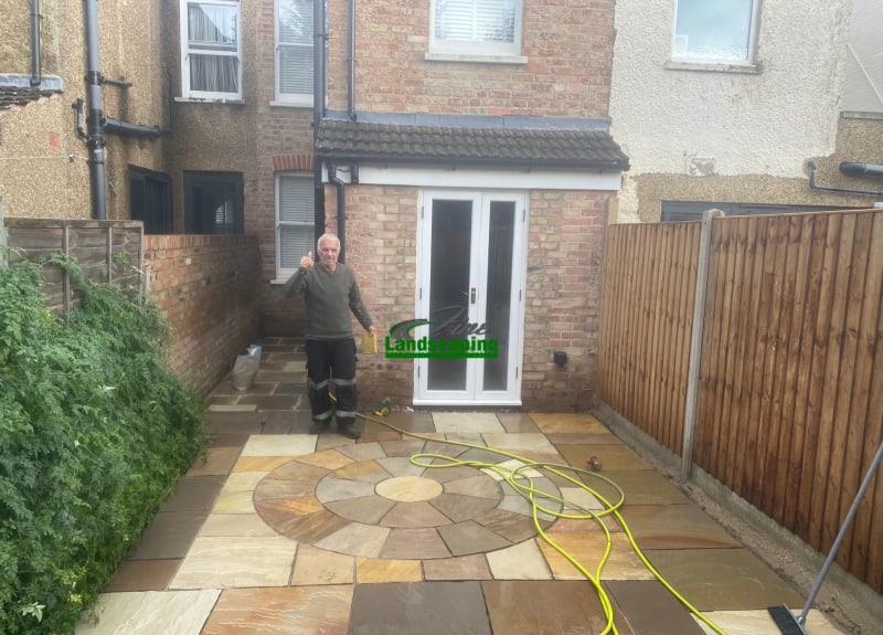 Mixed-tone stone patio with a circular paving feature