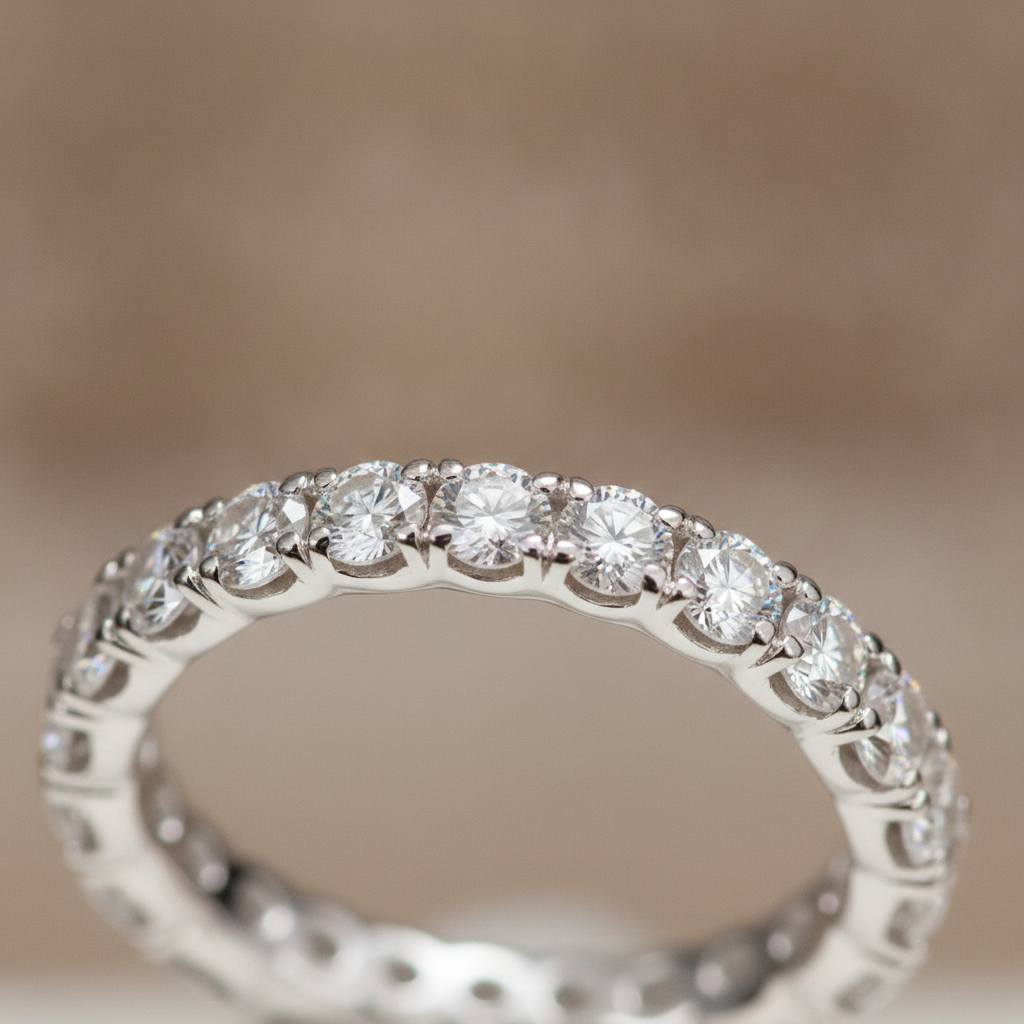 Macro close-up of a lab-grown diamond pavé eternity wedding band in 14k white gold showing micro-prongs and VS clarity stones