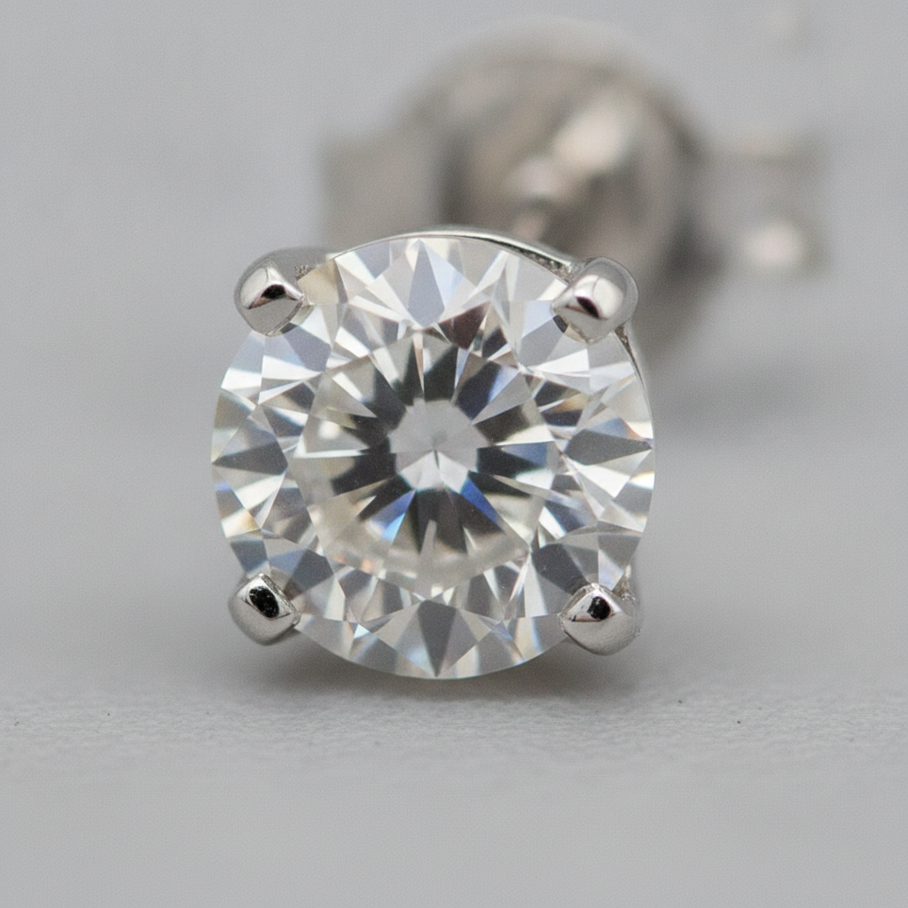 Close-up of round brilliant diamond stud earring highlighting cut and prong setting from leading diamond earrings brands