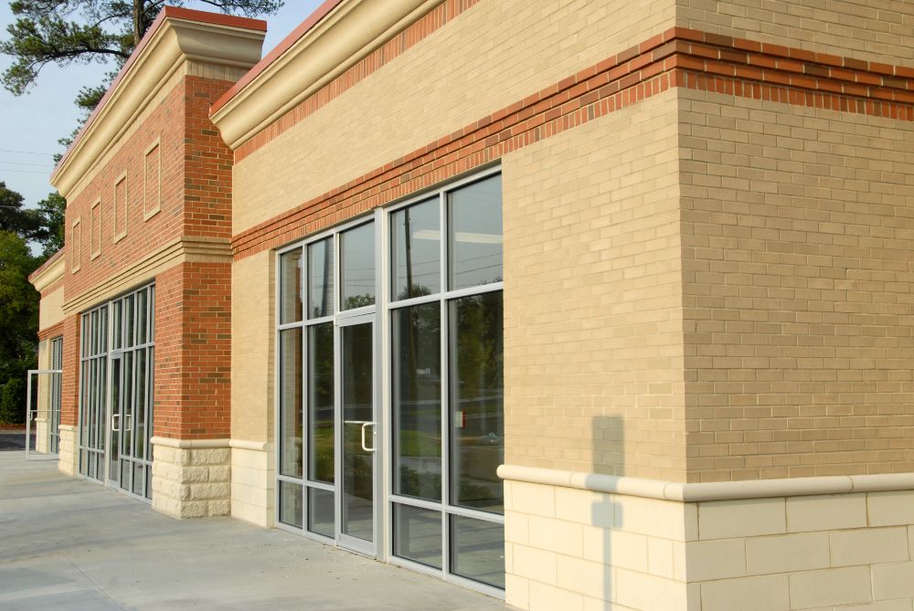 Professional commercial building exterior showcasing the business impact of regular pressure washing maintenance