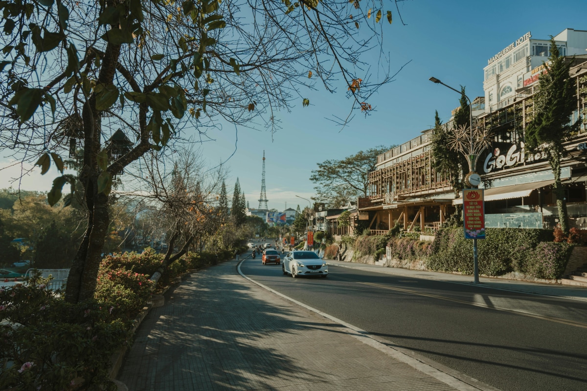 A picturesque street scene in Dalat, showcasing local architecture and scenic views.