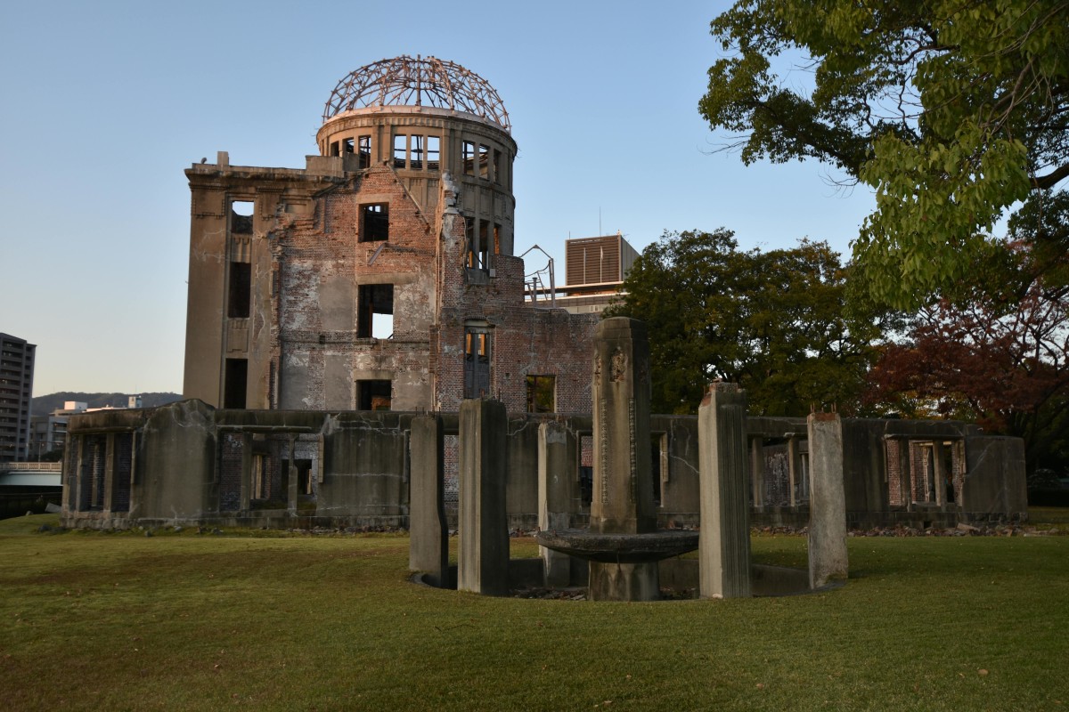 Historic Hiroshima Peace Memorial Dome in Japan at sunset, showcasing urban heritage.