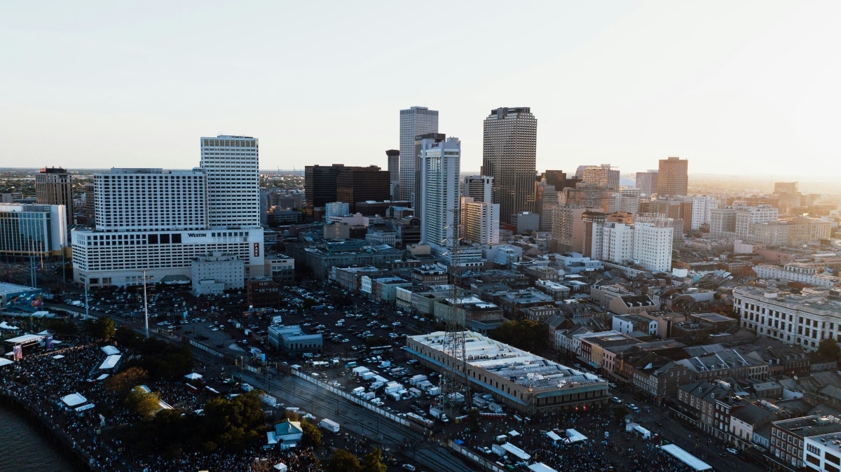 Breathtaking aerial view of New Orleans skyline with skyscrapers at sunset.