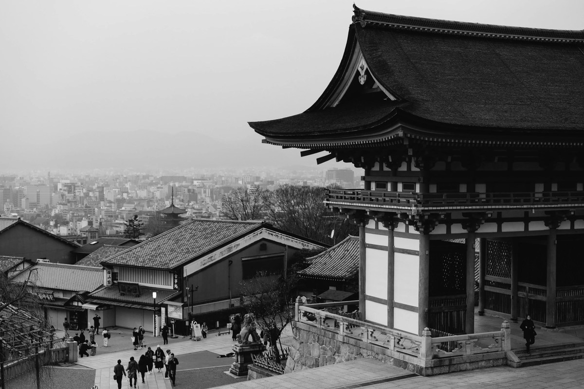Black and white traditional pagoda with Kyoto skyline