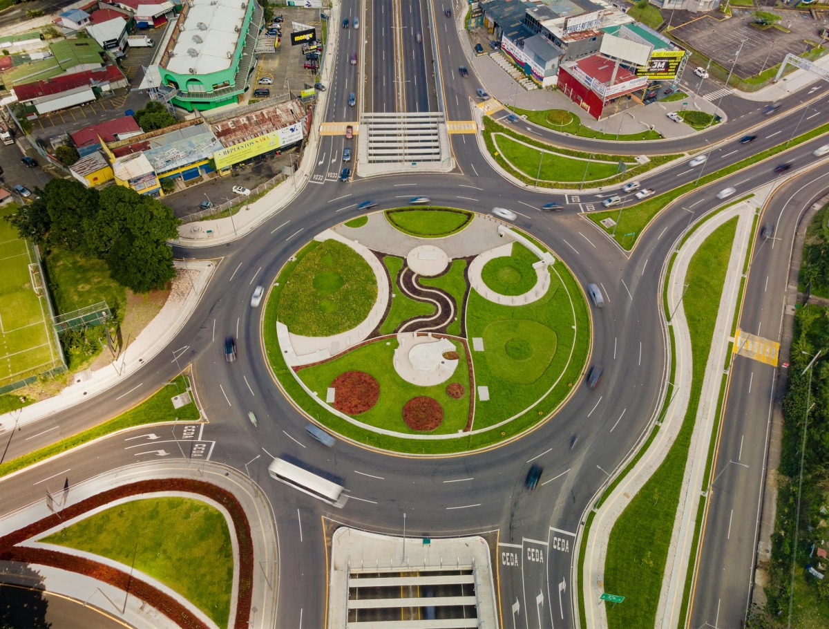 Vibrant aerial photograph of a bustling roundabout in San José, Costa Rica.