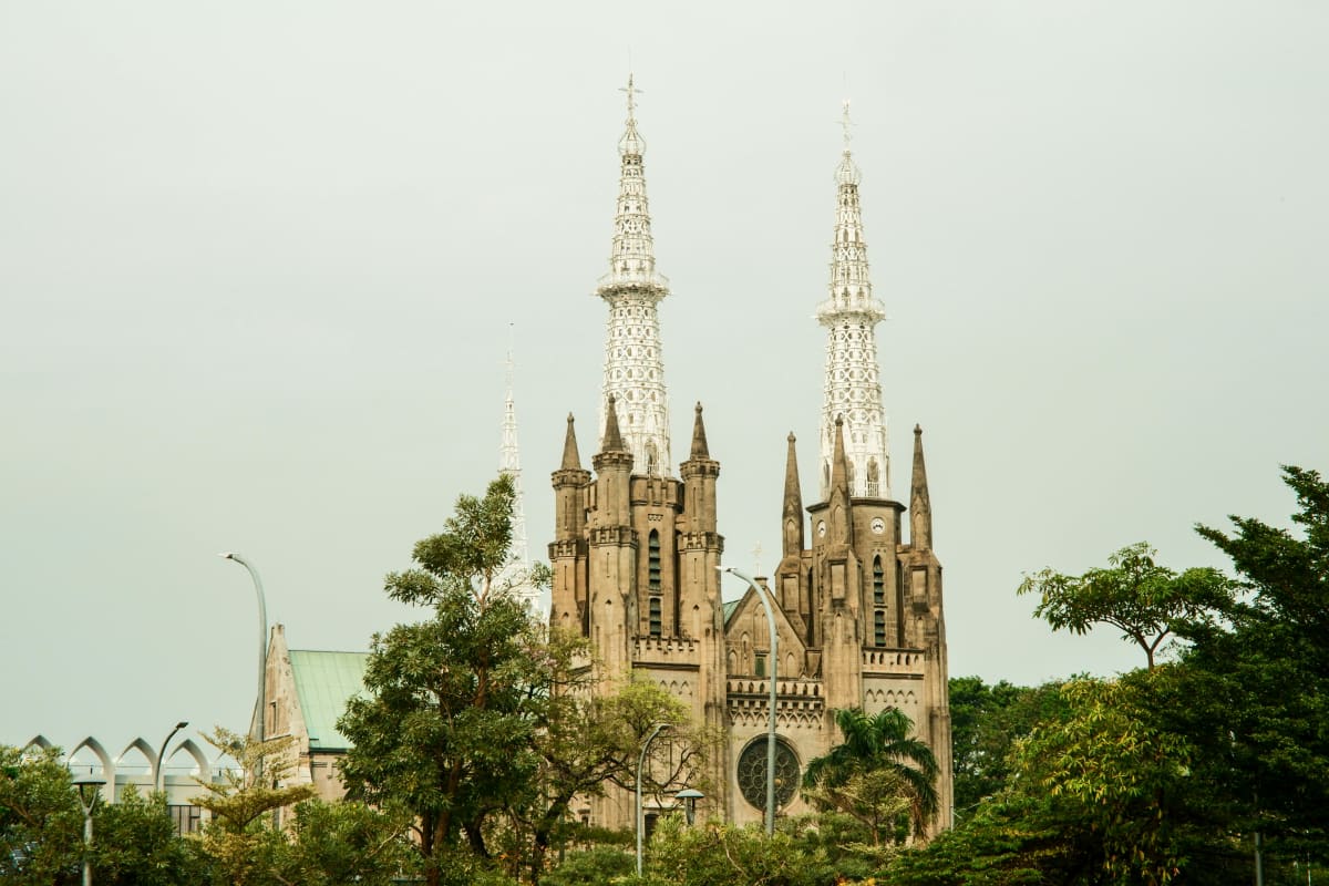 Captivating view of Jakarta Cathedral's towers against a serene sky.