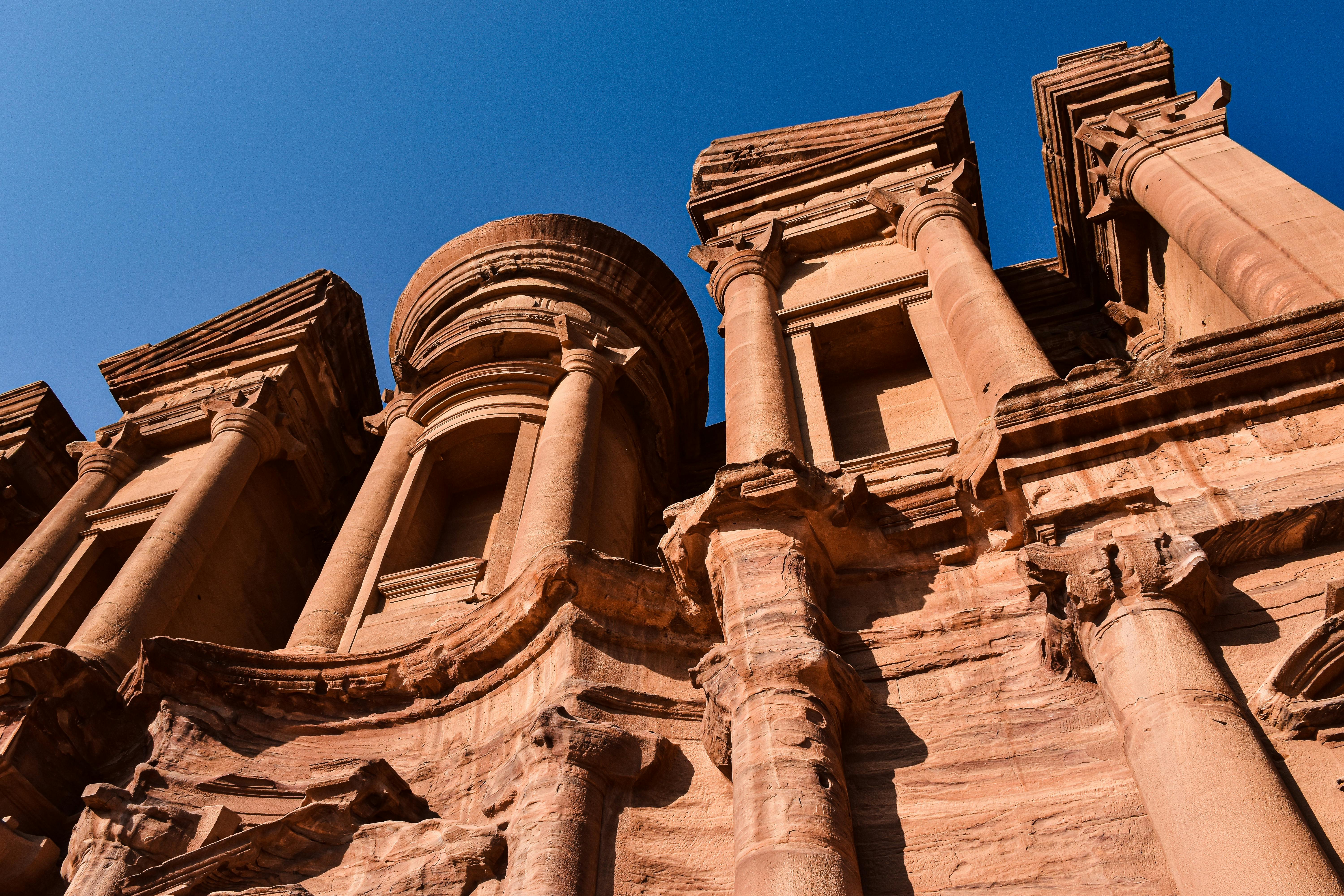 Petra Treasury Al-Khazneh seen through the Siq canyon