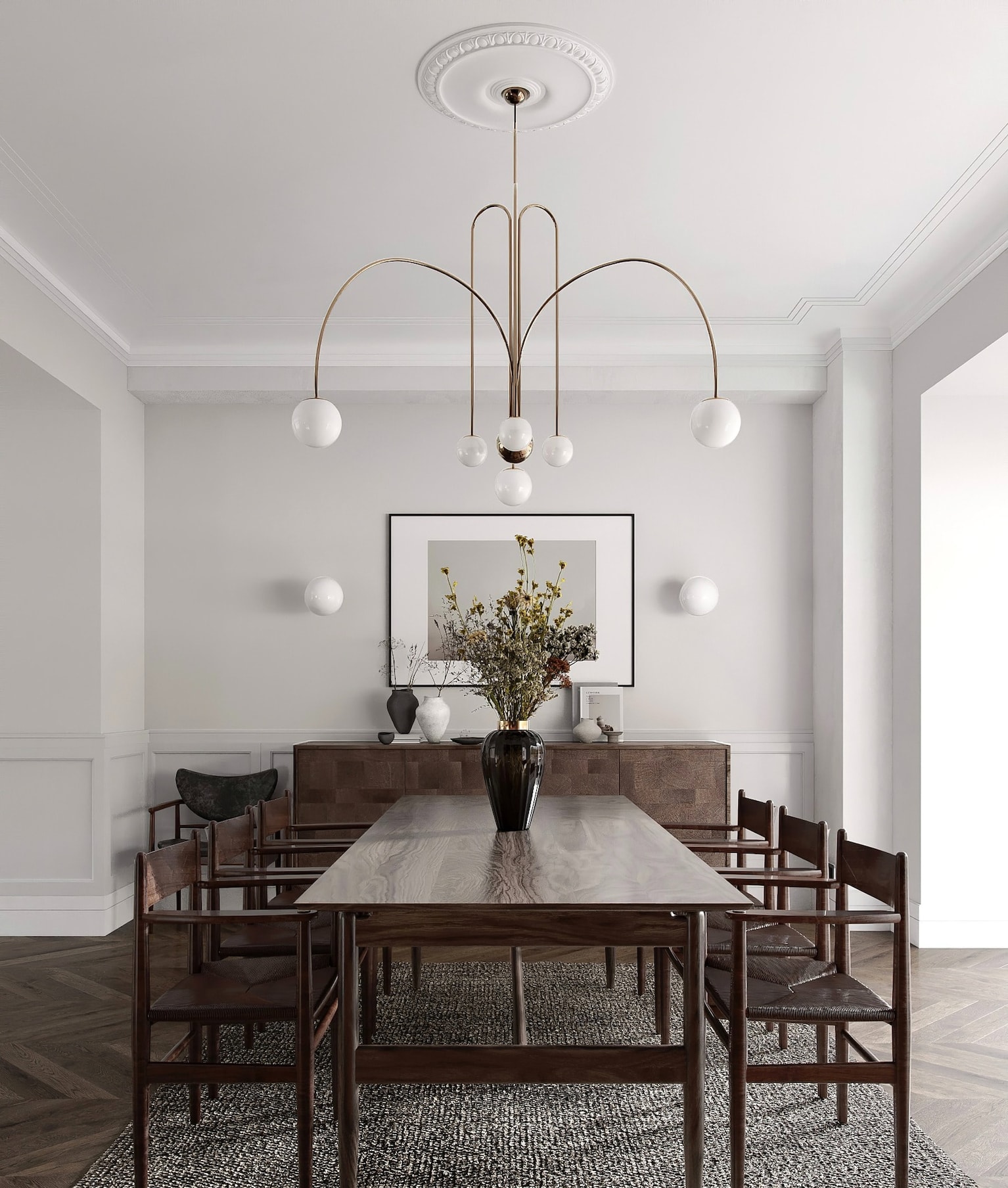 Dark wood table and chairs, rug, suspension light fixture with glass globes.