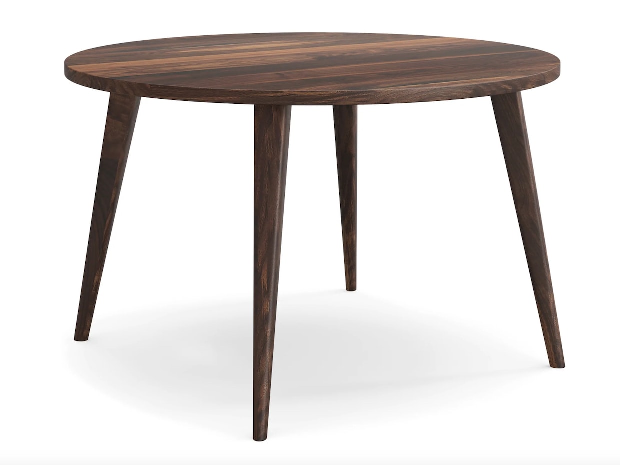 Table ronde en bois brun foncé, à pattes effilées