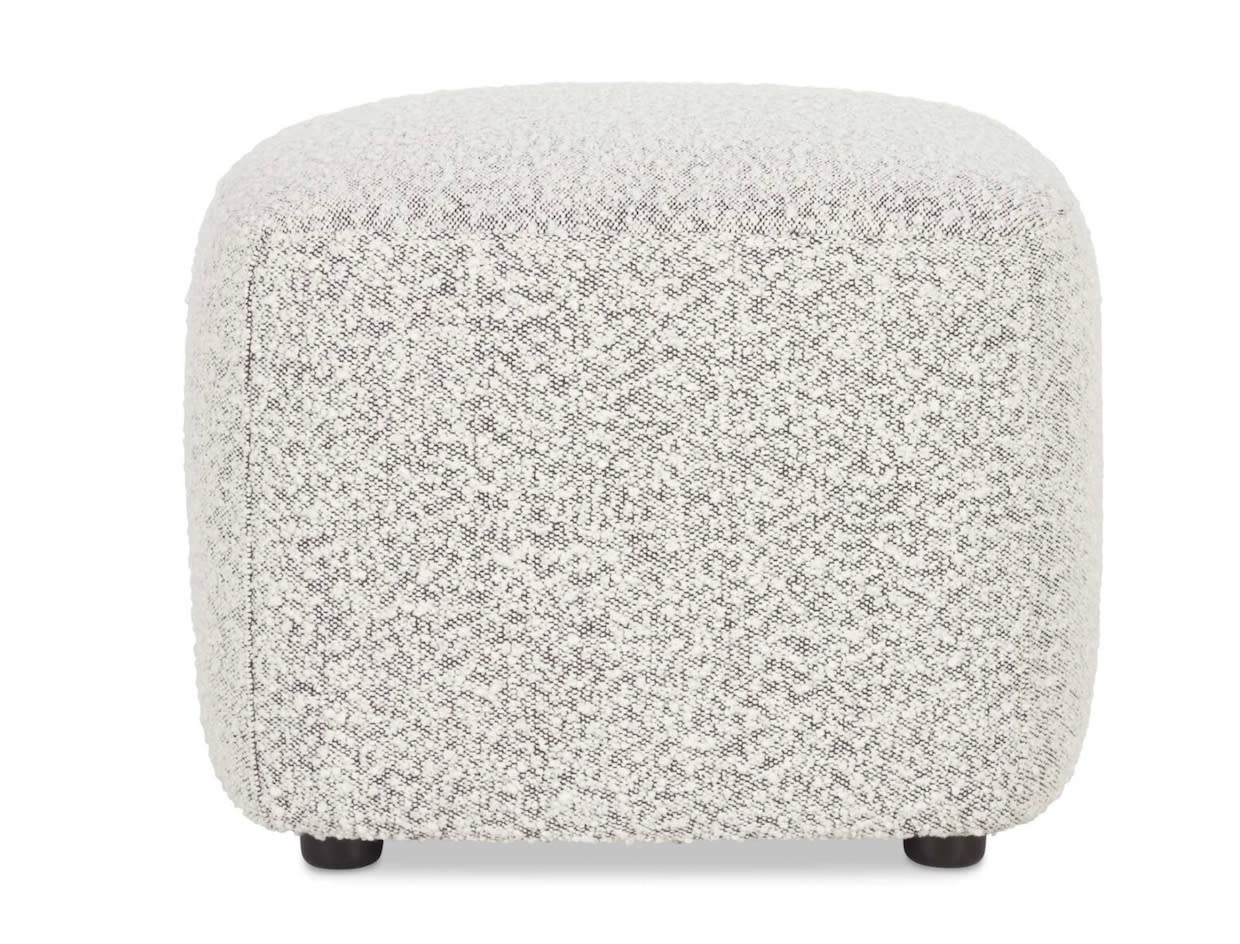 Pouf en laine bouclée blanc et noir moucheté, forme cube à coins arrondis