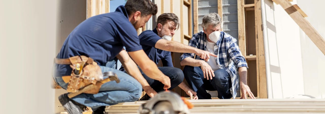 Contractors at work in a house to be renovated