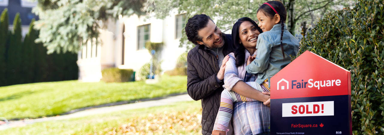 A family cheering near a house sold by FairSquare.