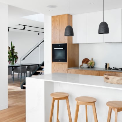 White kitchen with black pendant lights