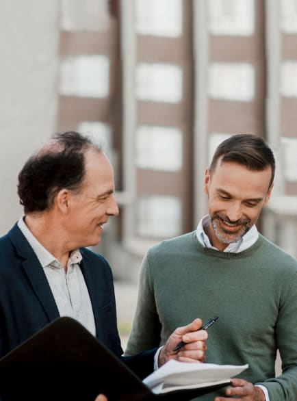 Real estate broker presenting documents to his client