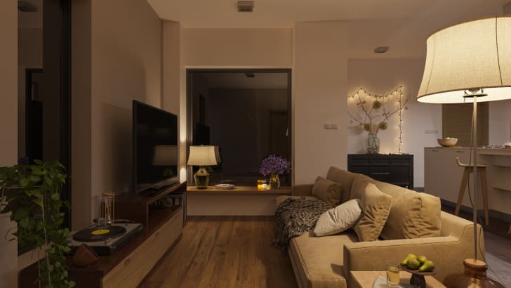 Living room lit by lamps and fairy lights at night