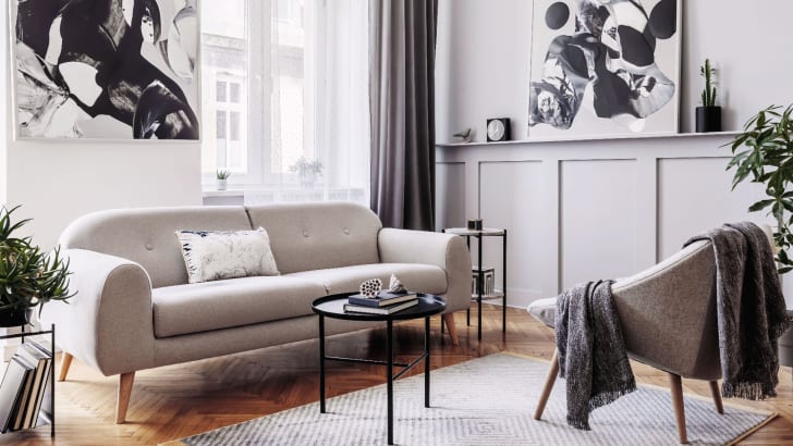 Stylish living room with grey furniture and black accessories