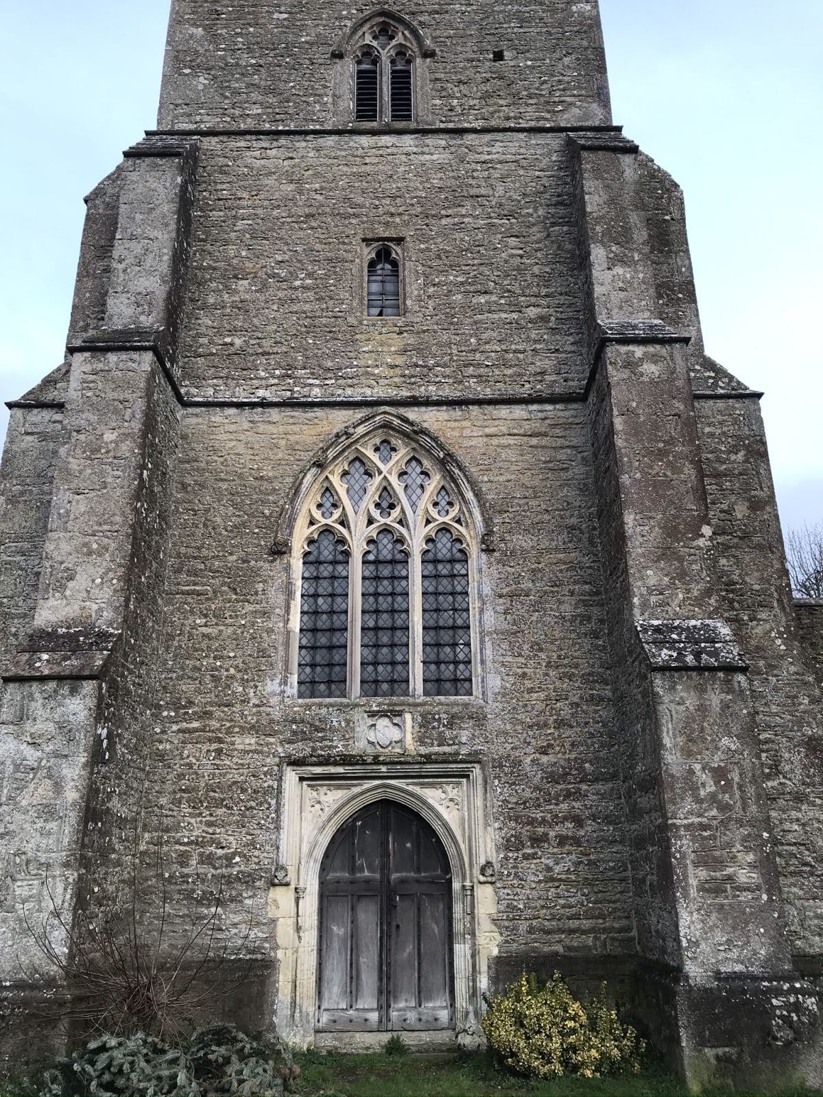 The view of the church from the west end, with the tower door and window, later additions to the older tower’s fabric
