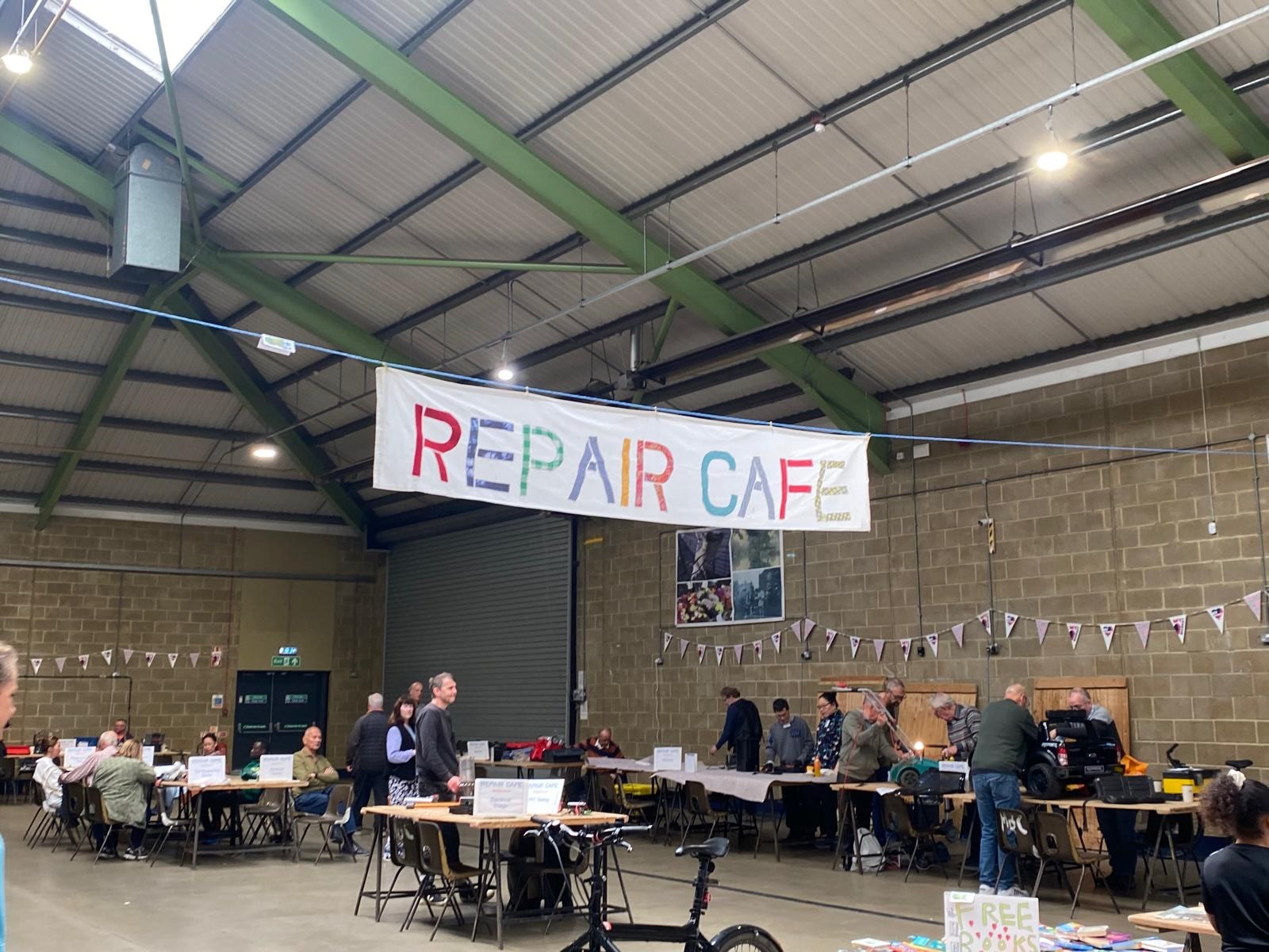 Repair Cafe volunteer inspecting an item for repair
