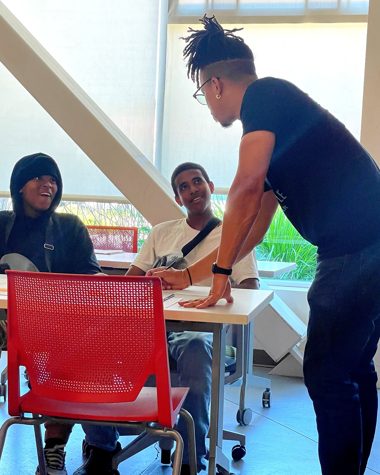 Devin helping students