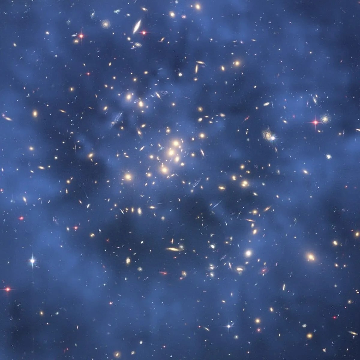 Cúmulo de galaxias CL0024+17 observado por el telescopio espacial Hubble, mostrando un efecto de lente gravitacional causado por materia oscura
