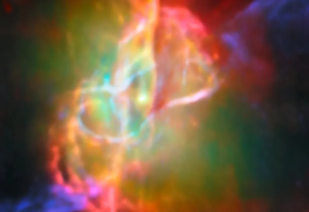 Imagen compuesta de la Nebulosa de la Mariposa con datos del Telescopio Espacial James Webb y ALMA, mostrando el toroide de gas y burbujas rojas iluminadas