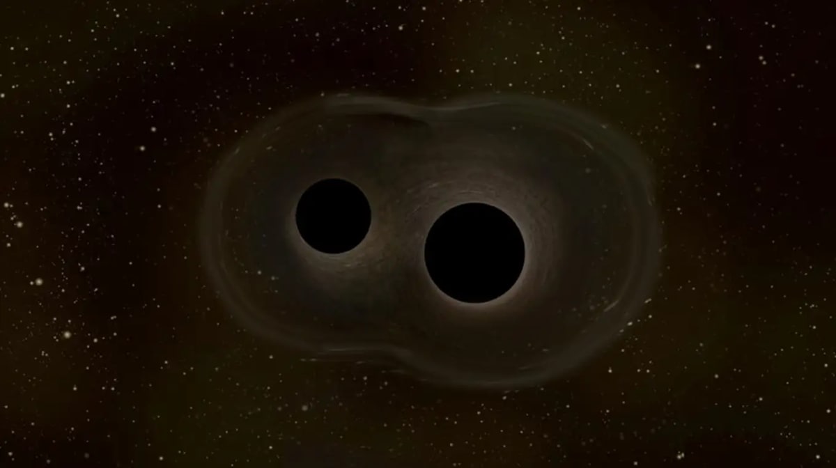 Representación de dos agujeros negros fusionándose y emitiendo ondas gravitacionales