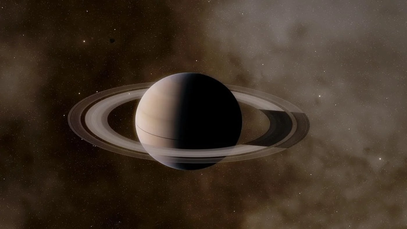 Vista detallada de Saturno desde el espacio, mostrando sus famosos anillos que lo rodean en una impresionante estructura circular, en un fondo estrellado