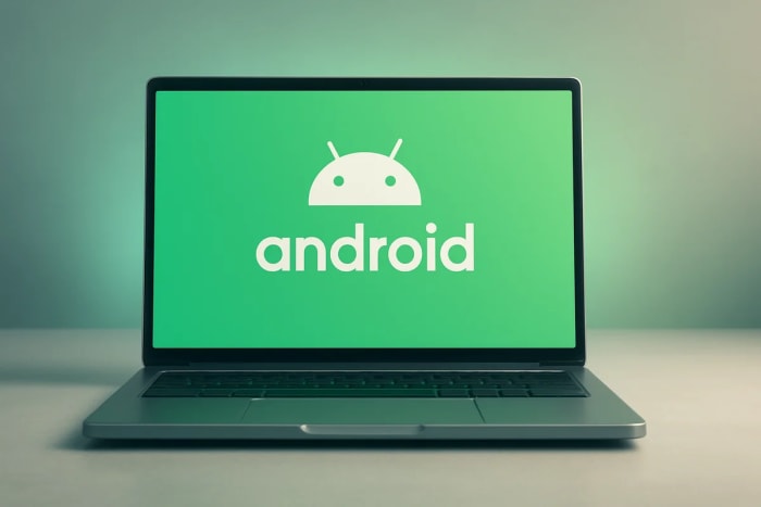 Portátil abierto sobre una mesa minimalista con la pantalla mostrando un fondo verde y el logotipo de Android