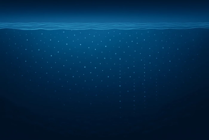 Columna de agua oceánica con microplásticos flotando en capas y otros hundiéndose hacia las profundidades