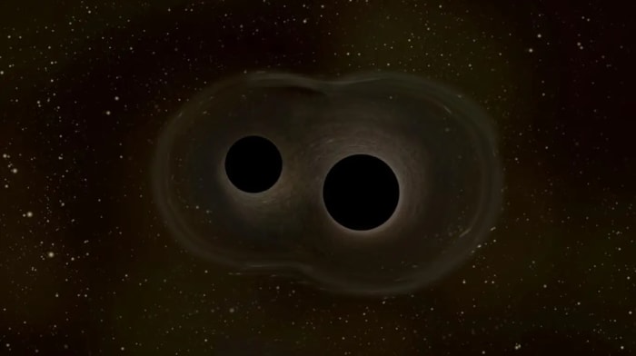 Representación de dos agujeros negros fusionándose y emitiendo ondas gravitacionales