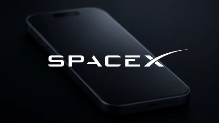 Logo de SpaceX sobre un teléfono difuminado.