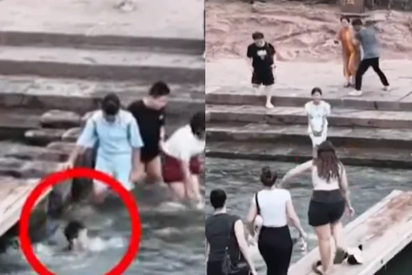 Marta Santana rescatando a un niño de ahogarse en el río Tuojiang, en Fenghuang, China