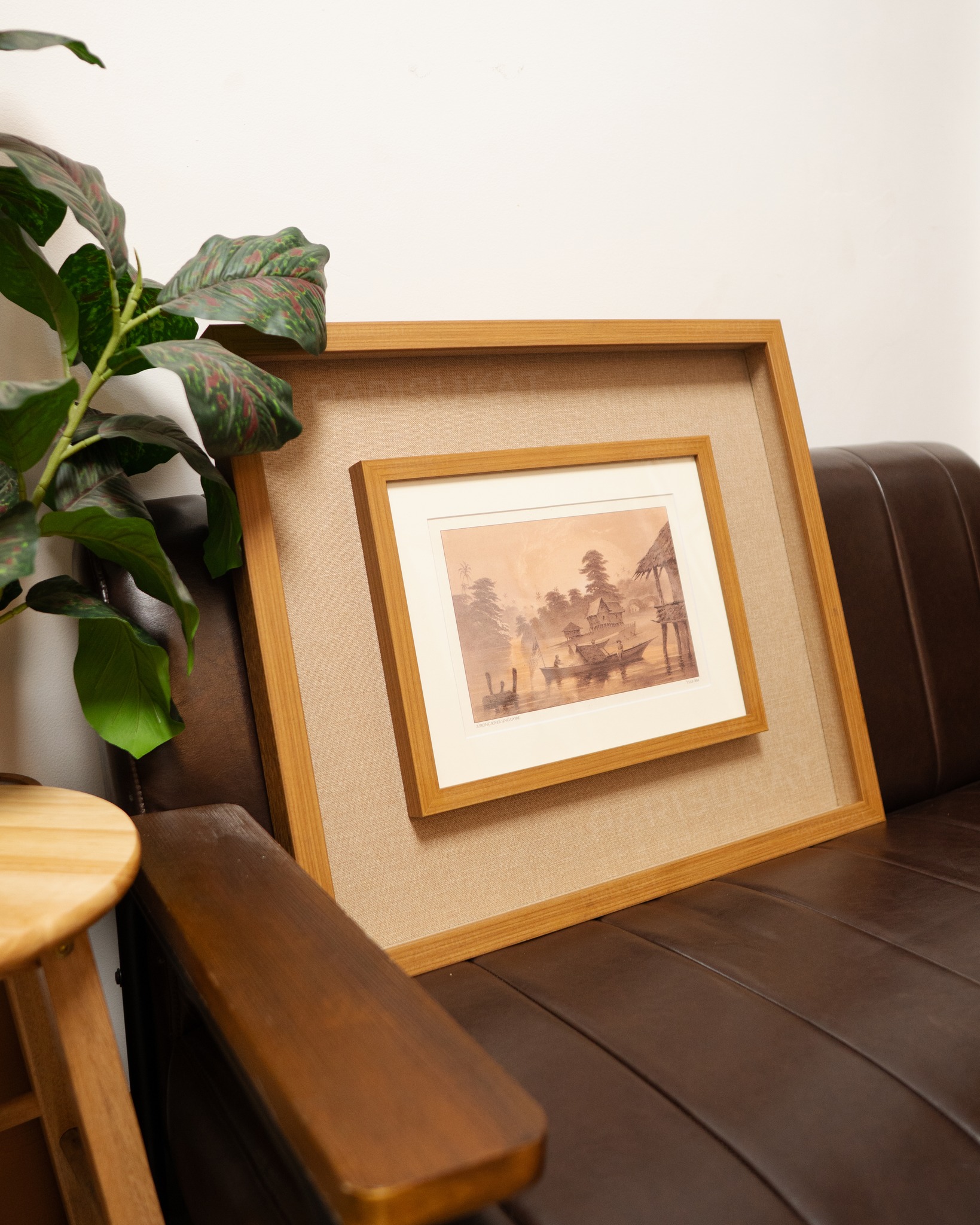 framed artwork in rattan and wood