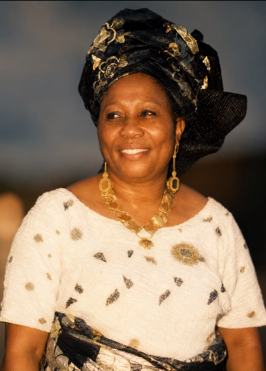 A dignified portrait representing Esther Idisi's legacy of care