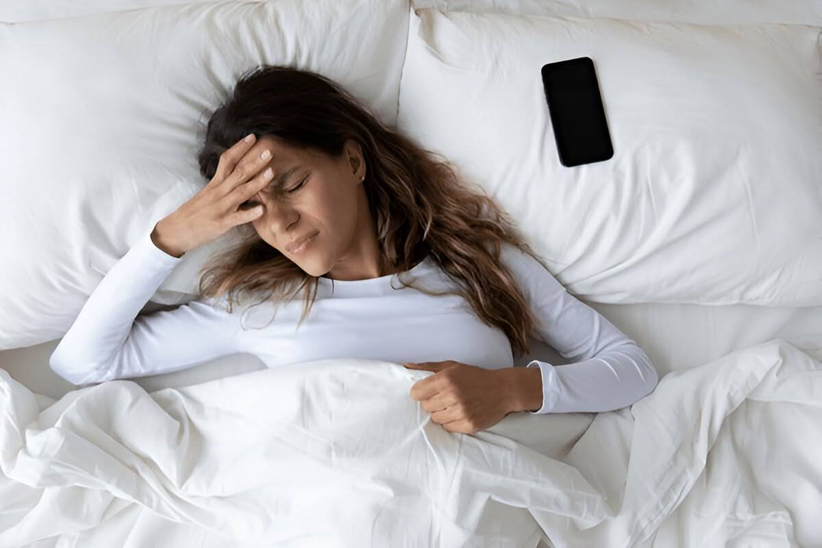 A woman unable to sleep due to stress and anxiety
