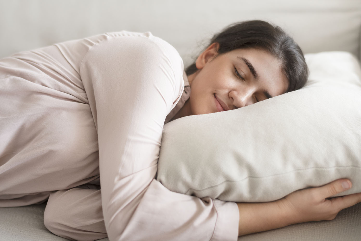 A woman sleeping comfortably on her side