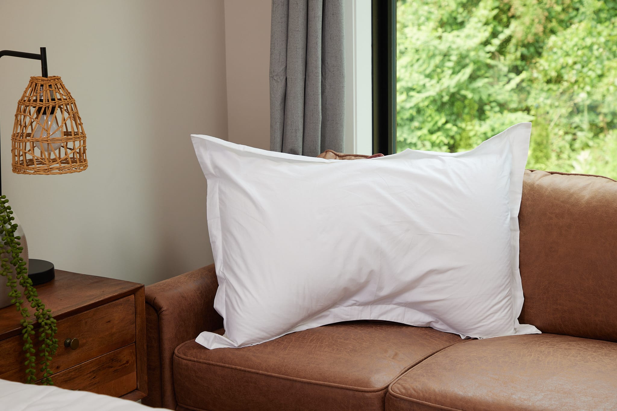 Pillow with pillowcase on sofa