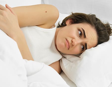 A woman with a numb hand after sleeping.