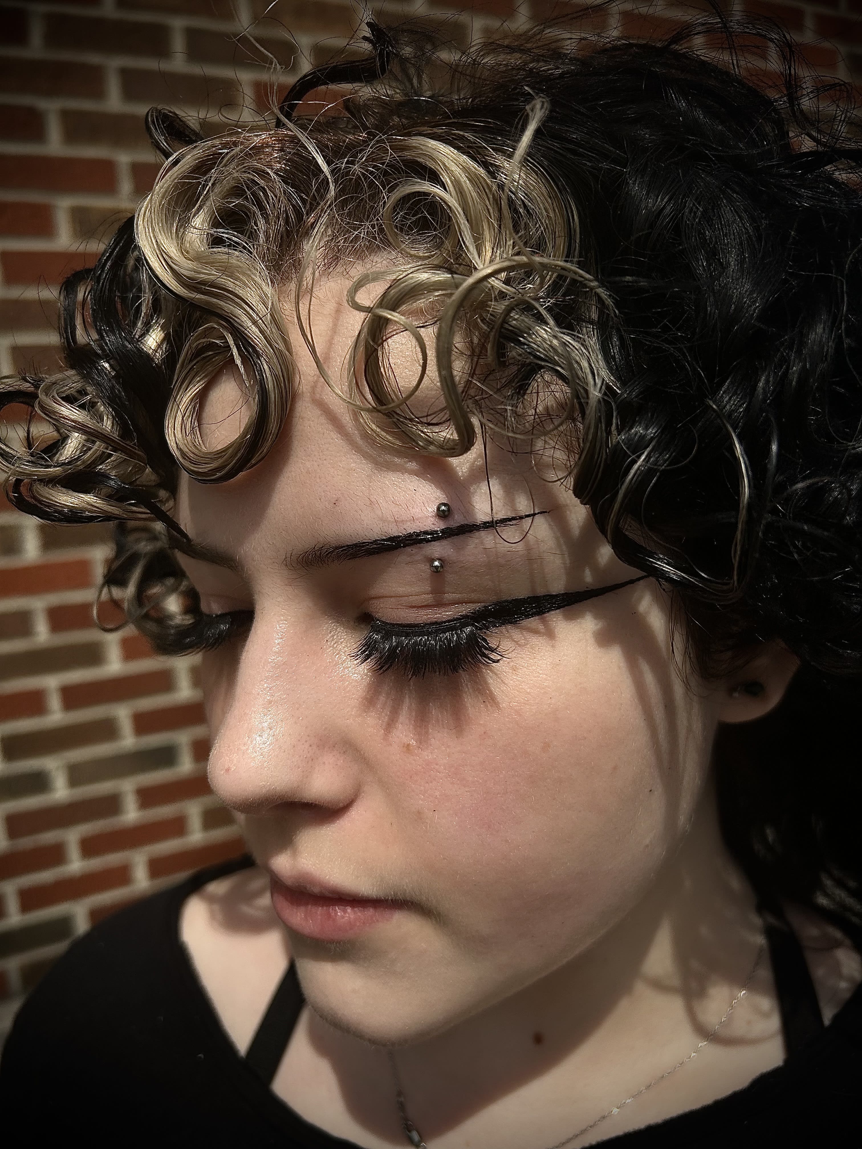 A nicely healed, downsized eyebrow.