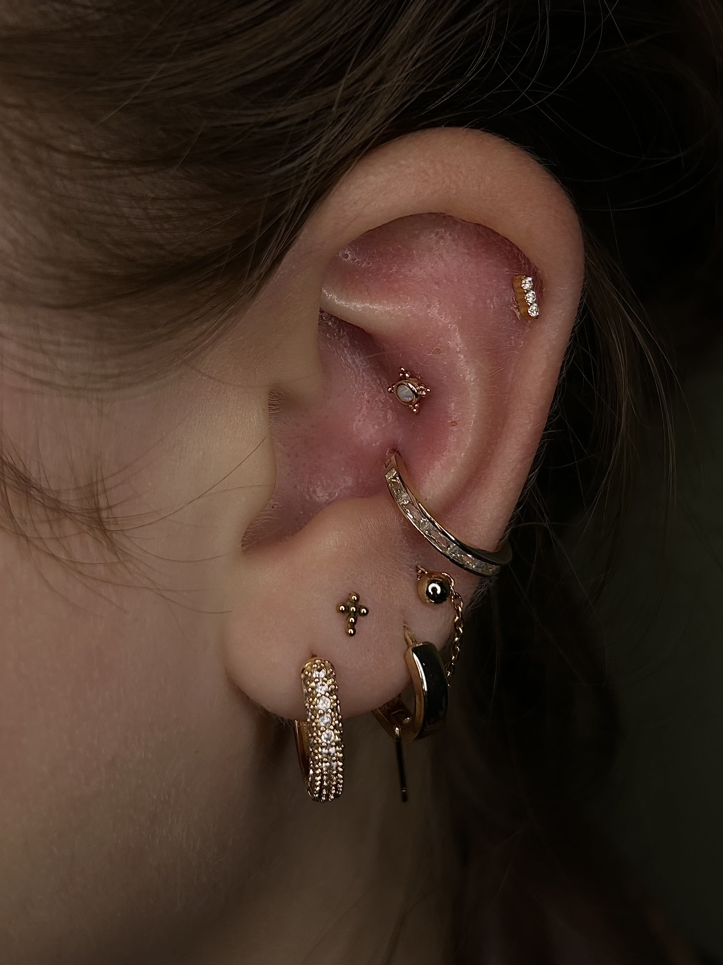 Healed conch piercing switched out to a beautiful gold hoop from Ember Body Jewelry. Upper conch is healing nicley!