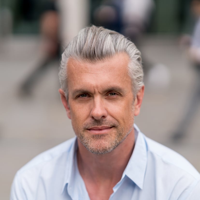 Mohs surgery: Mature man with gray hair looking confidently at the camera