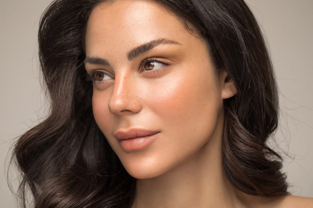 Youthful facial contours: Close-up of a woman with smooth skin and defined cheeks