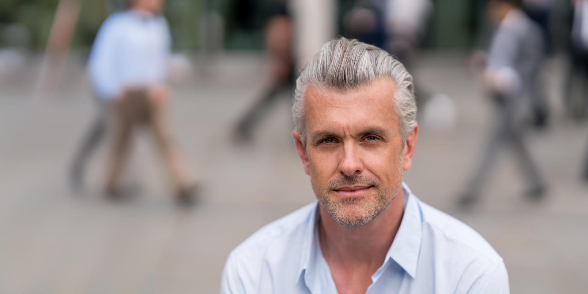 Mohs surgery: Mature man with gray hair looking confidently at the camera