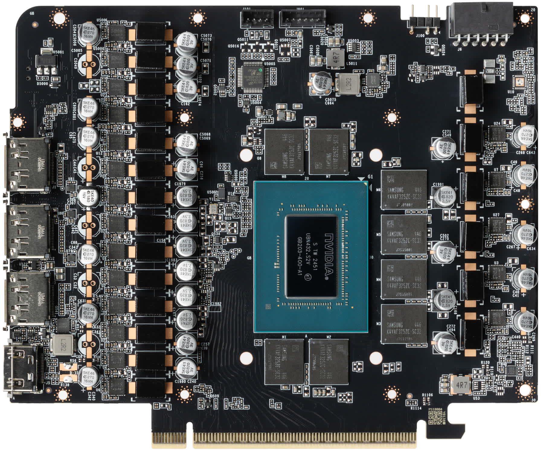 Disassembled graphics card with the cooler removed exposing the memory chip layout around the GPU