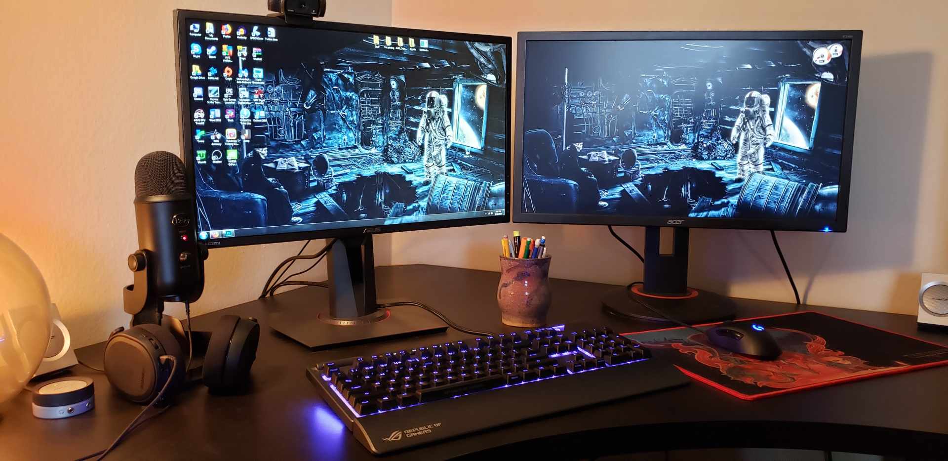 Dual monitor gaming setup with a game running on the primary display and a second screen alongside it