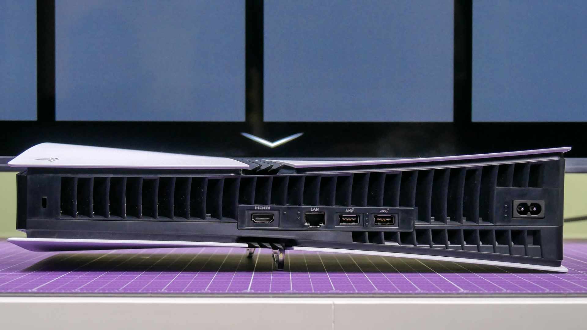 An HDMI cable plugged into the rear port of a games console