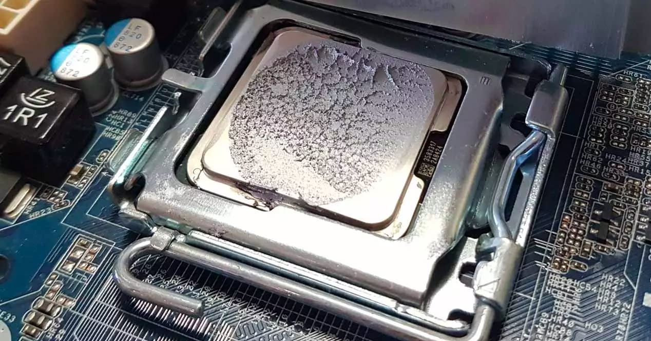 Fresh thermal paste applied to a CPU heat spreader before reseating the cooler