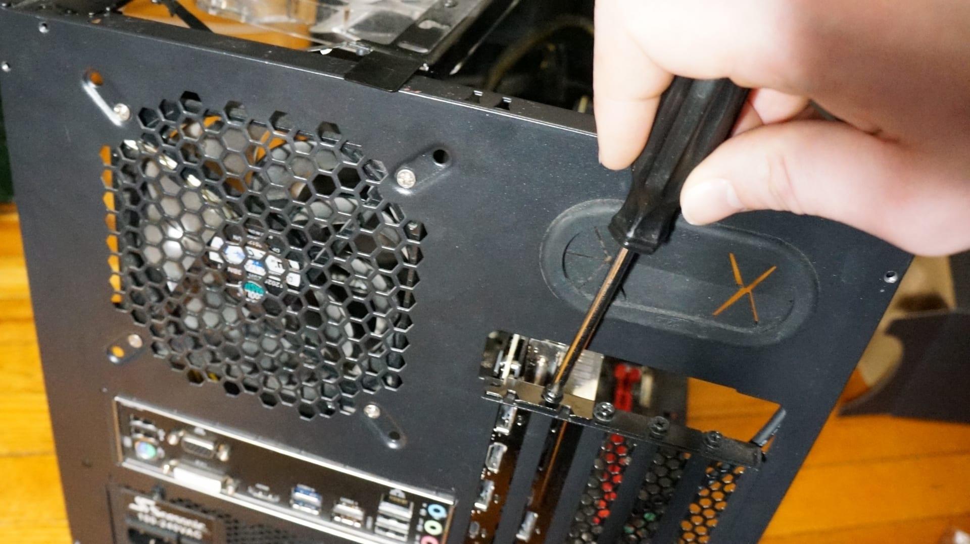 Graphics card being installed during an upgrade, the most common reason a working part gets retired