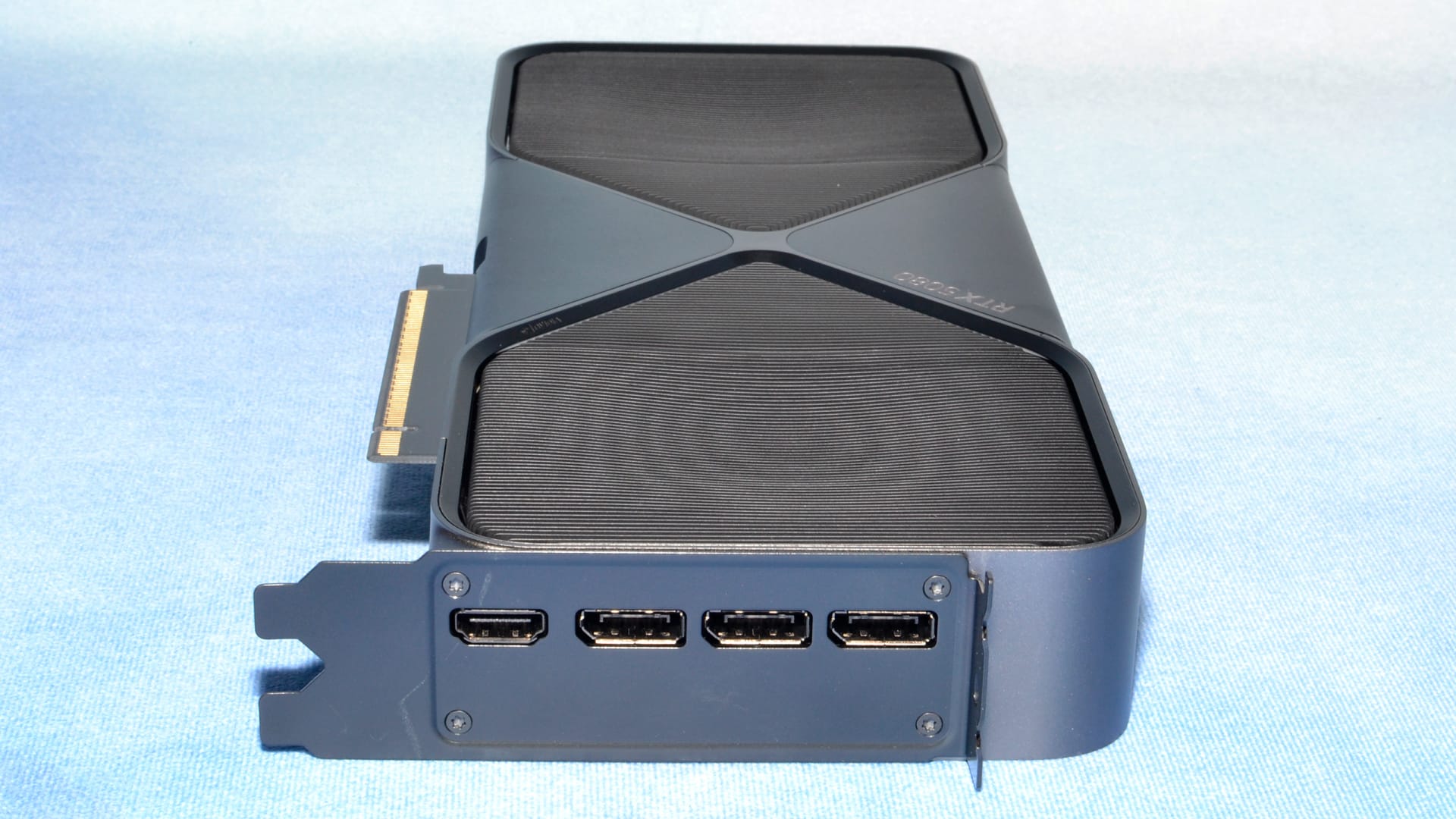 Open-air test bench with a high-end graphics card and CPU cooler installed for 4K benchmarking